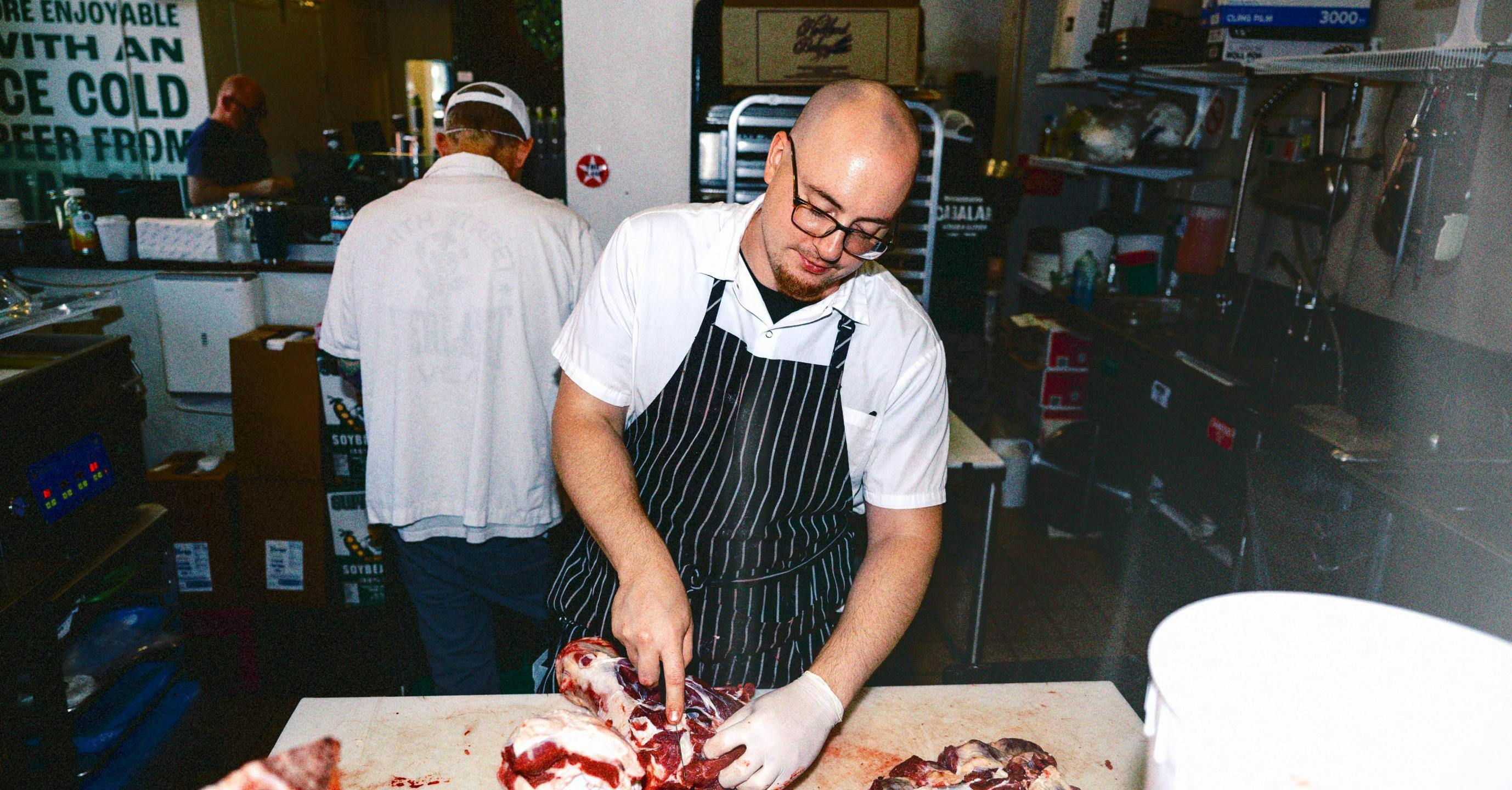 Steve Cabalar cutting meat
